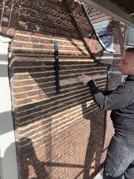 Baksteen en voeg van dichtbij